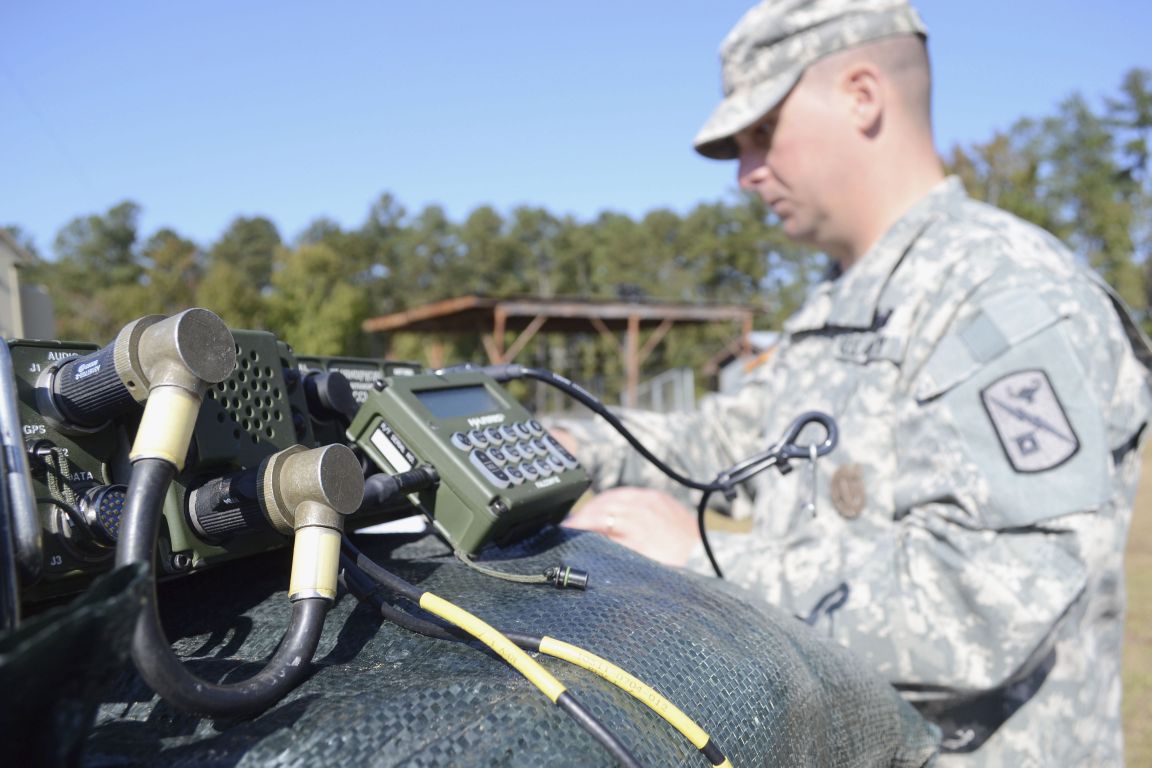 A US Army radio operator works on high frequency radio AN/PRC 1510 at Fort Gordon, Georgia.  (Credit: US Army)